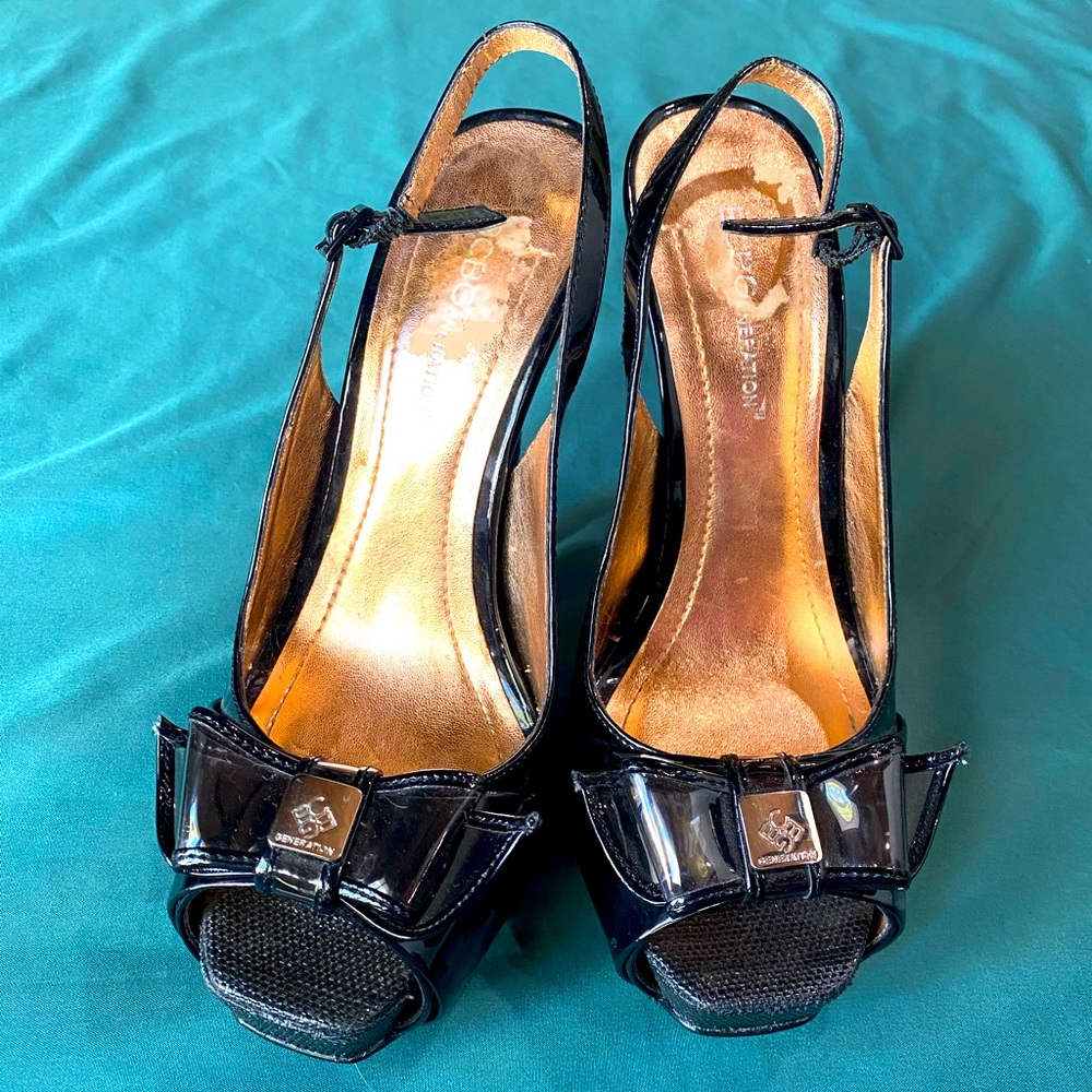 BCBGeneration black 5” heels with clear bow detail, size 7 1/2